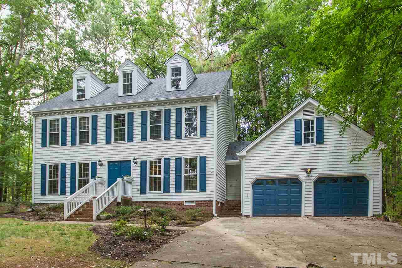 10005 Bavin Place Raleigh, NC 27613 - Photo 1 of 30 a front view of a house with a yard