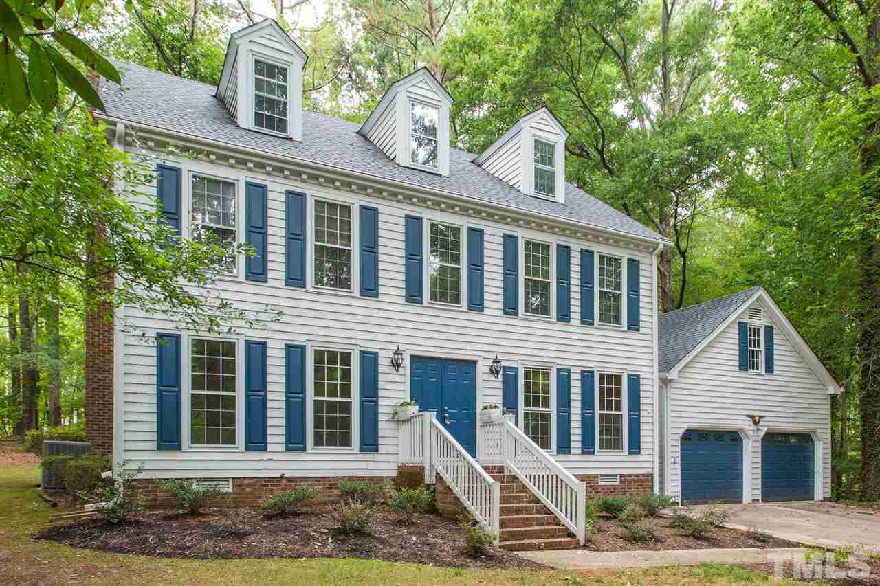 10005 Bavin Place Raleigh, NC 27613 - Photo 2 of 30 a front view of a house with a yard