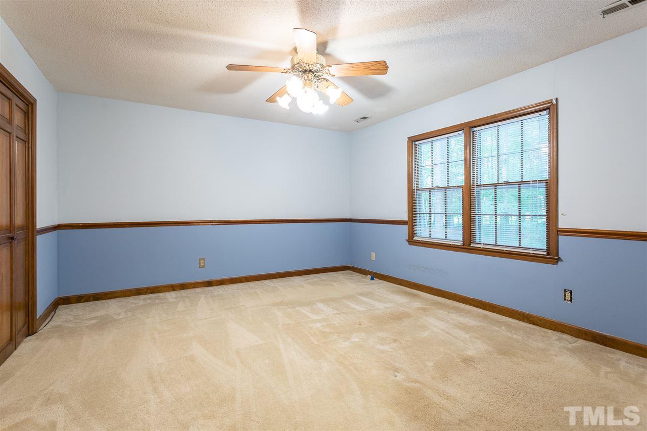 10005 Bavin Place Raleigh, NC 27613 - Photo 13 of 30 a view of an empty room with windows