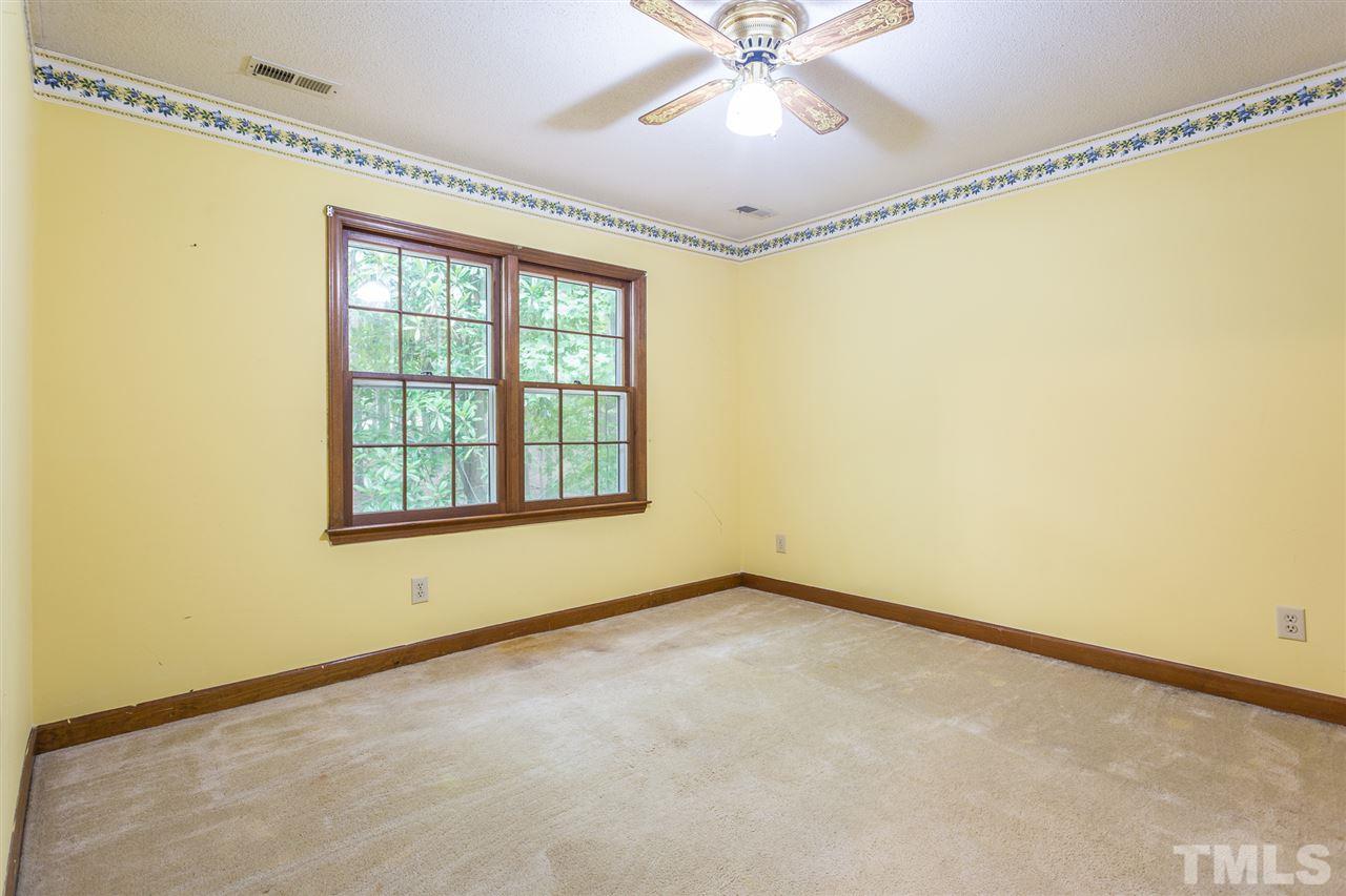 10005 Bavin Place Raleigh, NC 27613 - Photo 16 of 30 a view of an empty room with a window