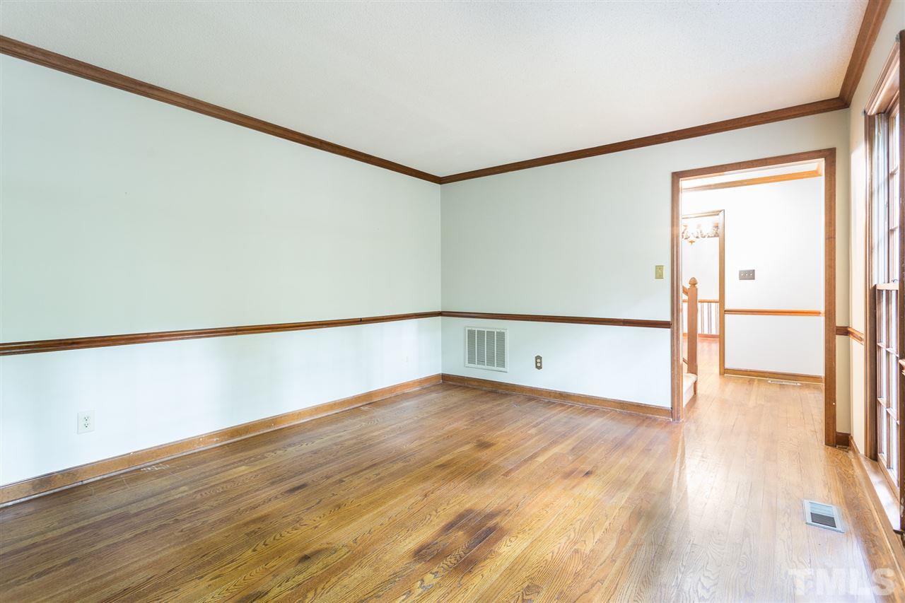 10005 Bavin Place Raleigh, NC 27613 - Photo 5 of 30 a view of an empty room with wooden floor