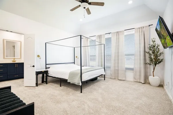 a bedroom with a bed and cabinets