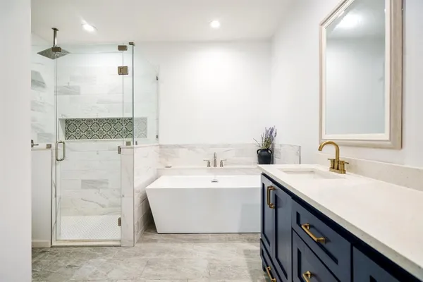 a bathroom with a double vanity sink and a toilet