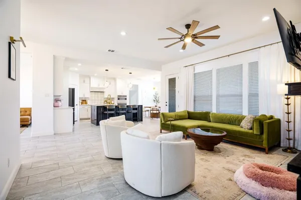 a living room with fireplace furniture and a flat screen tv