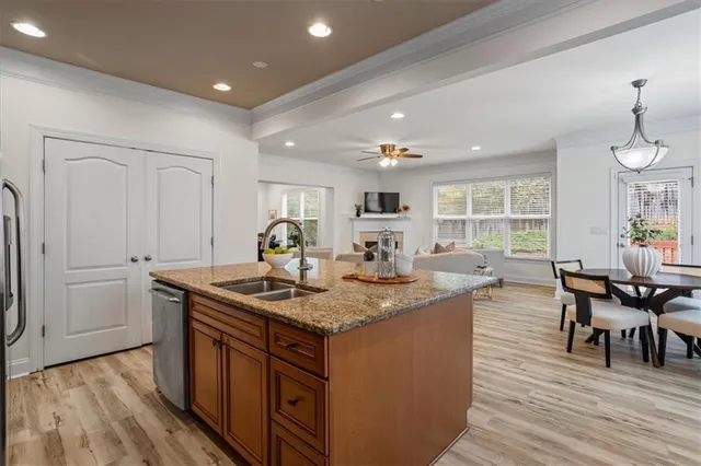 a view of a hallway with wooden floor and a window
