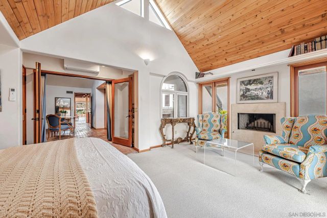 a view of a livingroom with a fireplace and a couch