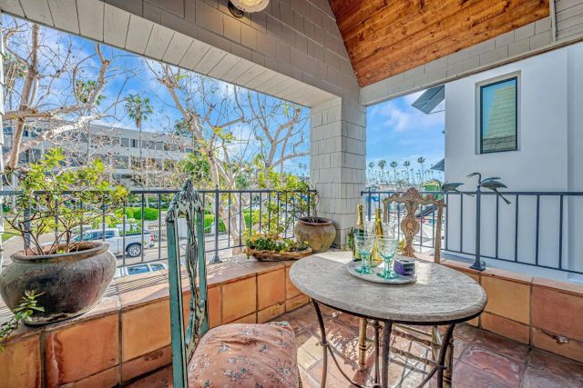 a view of a dining room with furniture a chandelier and wooden floor