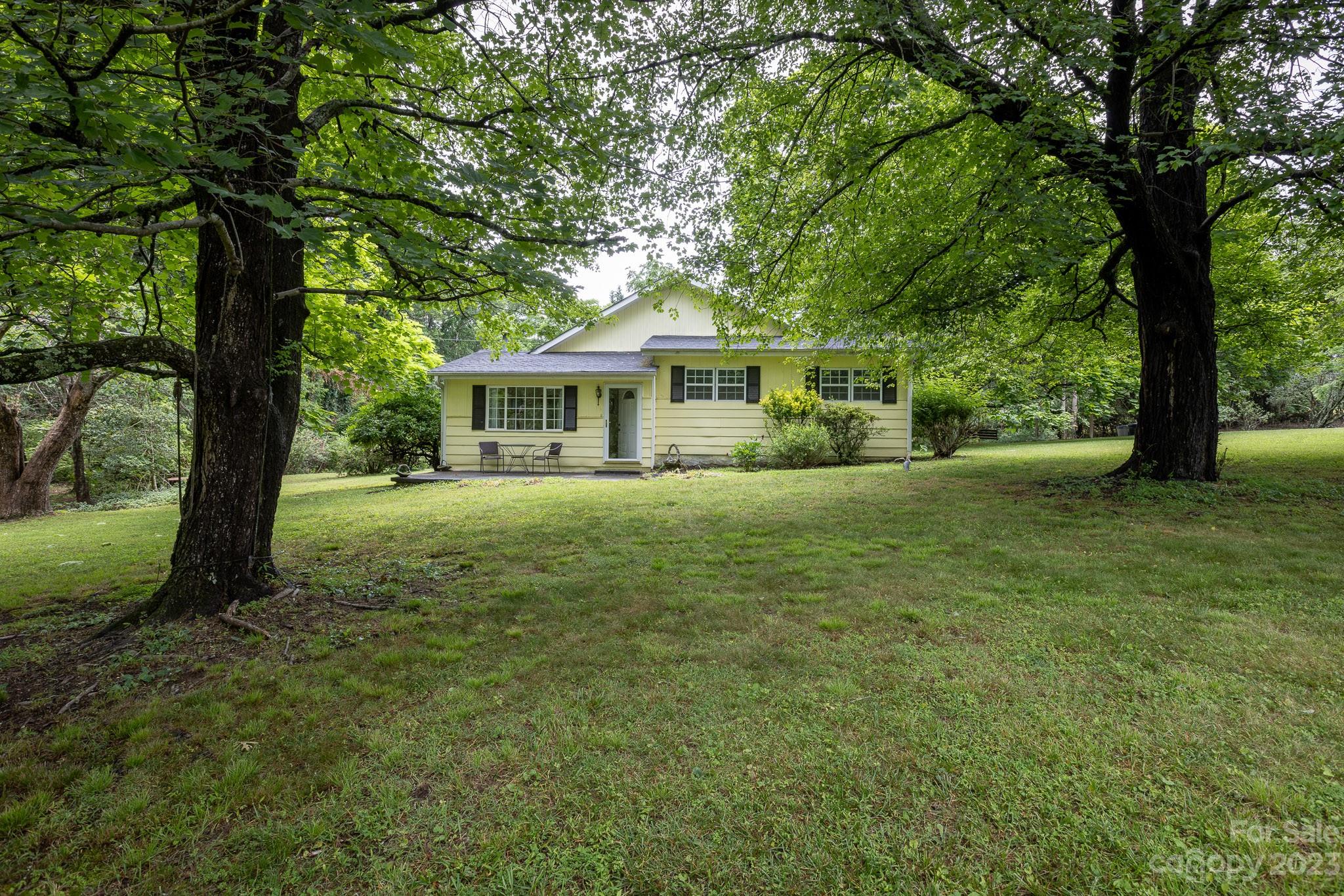 777 Glenn Bridge Road Arden, NC 28704 - Photo 1 of 22 a view of house with a garden