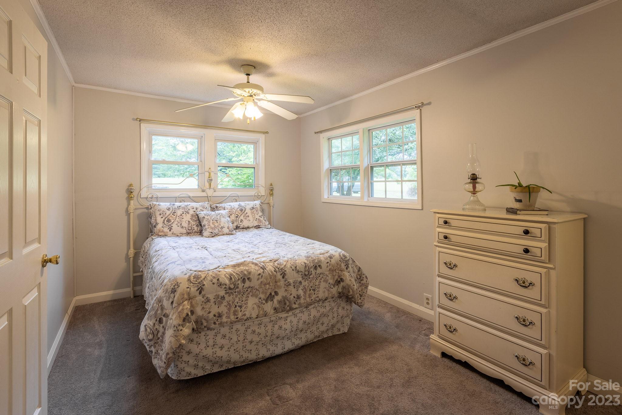 777 Glenn Bridge Road Arden, NC 28704 - Photo 14 of 22 a bedroom with a bed and a window
