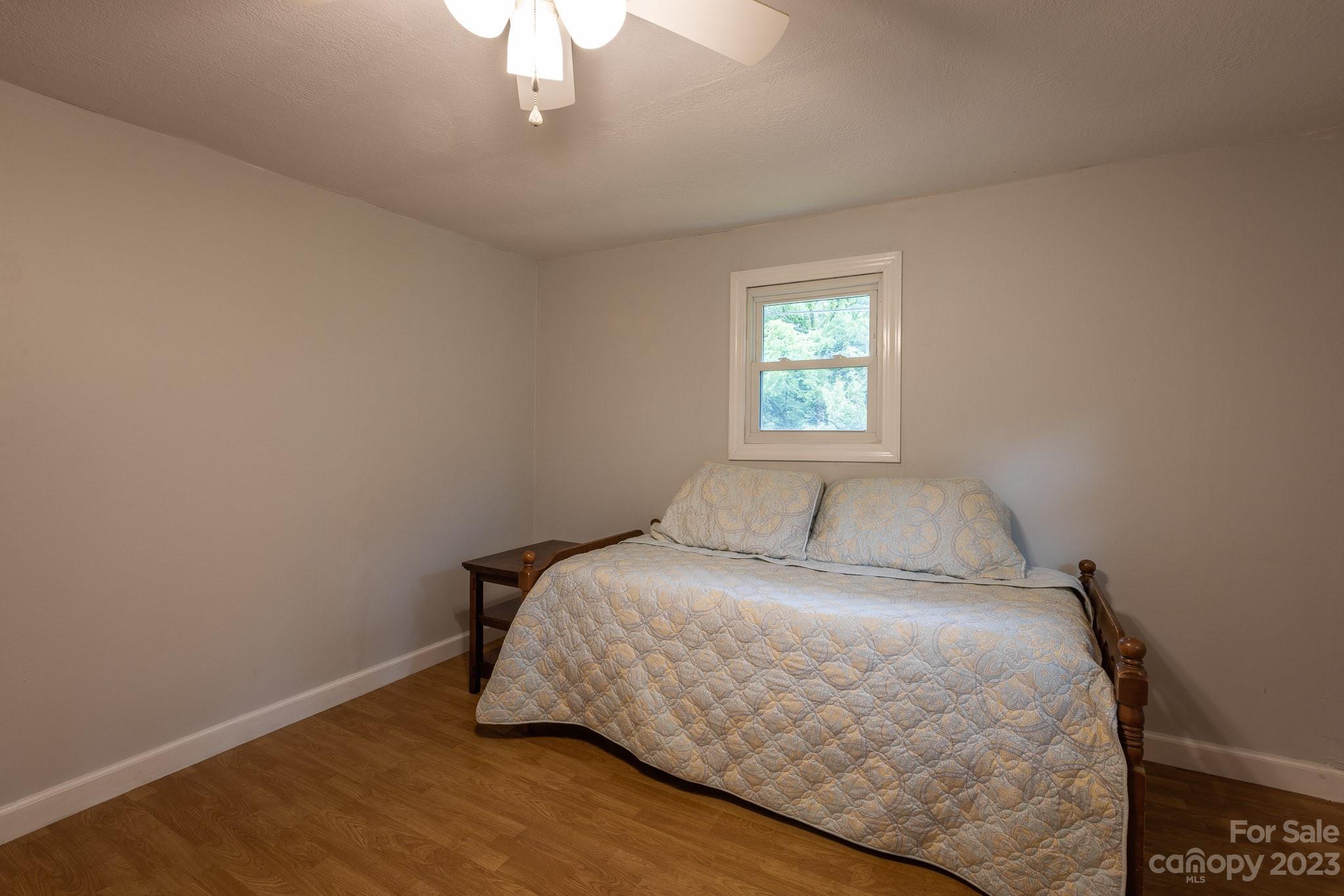 777 Glenn Bridge Road Arden, NC 28704 - Photo 17 of 22 a bedroom with a bed and window