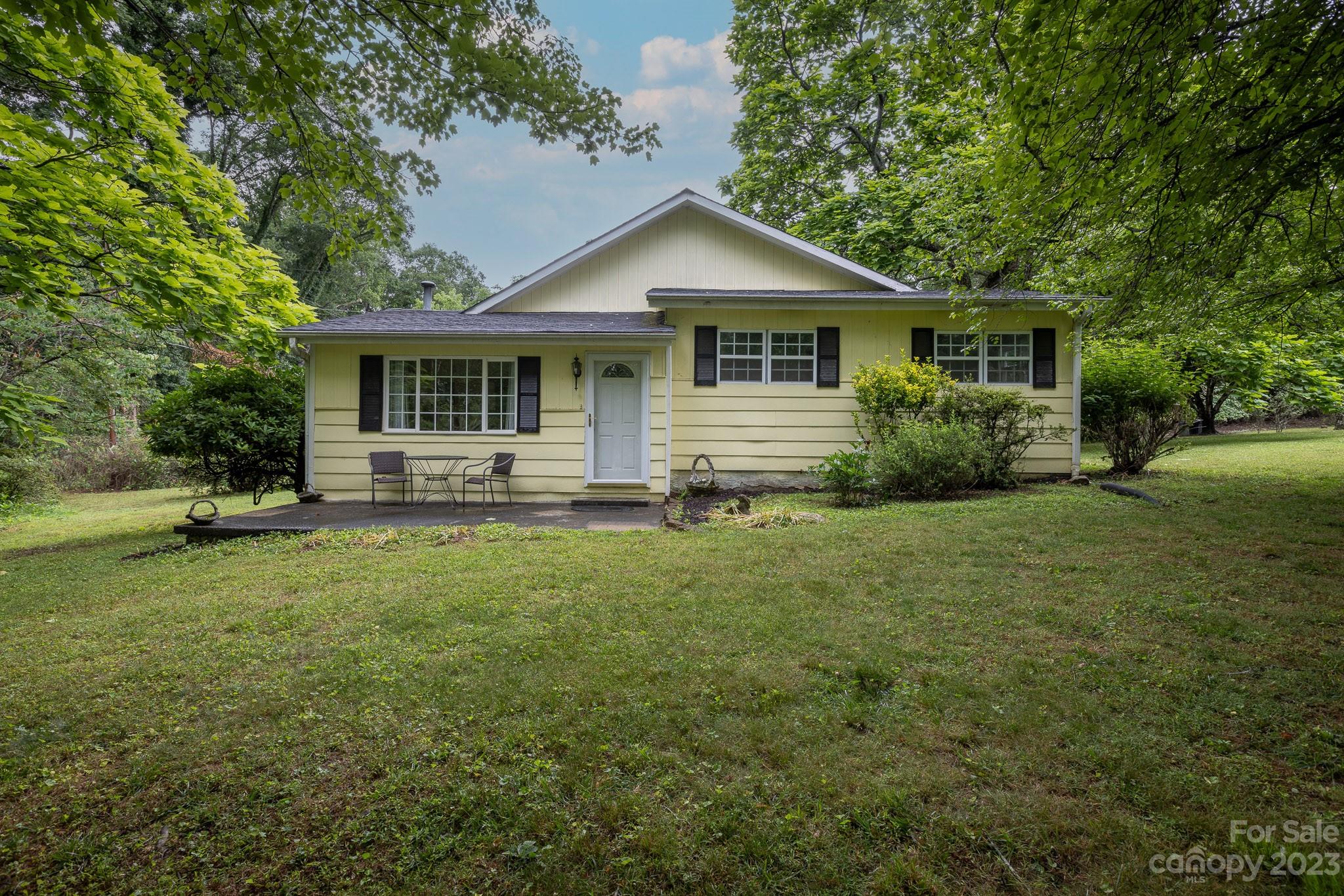777 Glenn Bridge Road Arden, NC 28704 - Photo 2 of 22 a front view of house with yard and green space