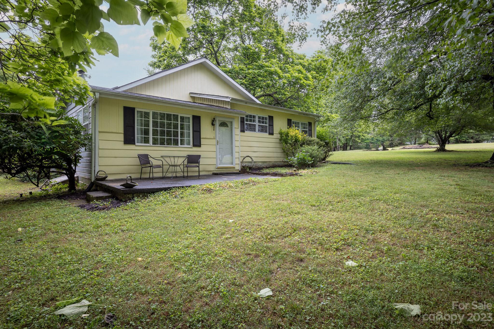 777 Glenn Bridge Road Arden, NC 28704 - Photo 4 of 22 a view of a house with a yard