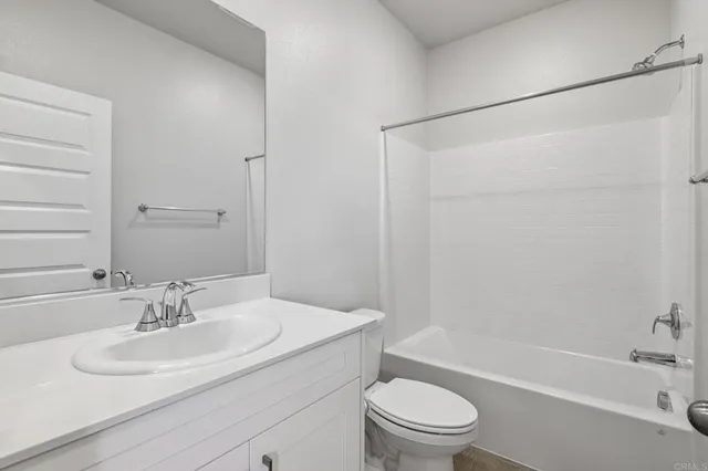 a bathroom with a sink toilet and a bathtub