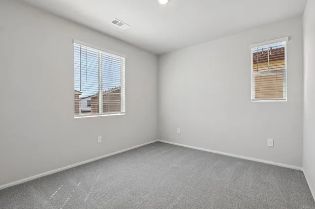 an empty room with walk in closet
