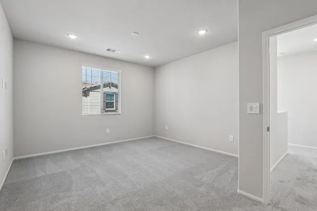 an empty room with closet area