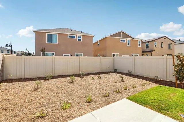 a view of a house with a snow on the road