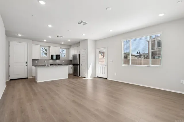 a view of kitchen with wooden floor