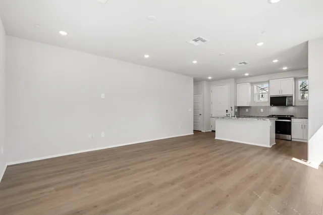 a view of kitchen with wooden floor and window