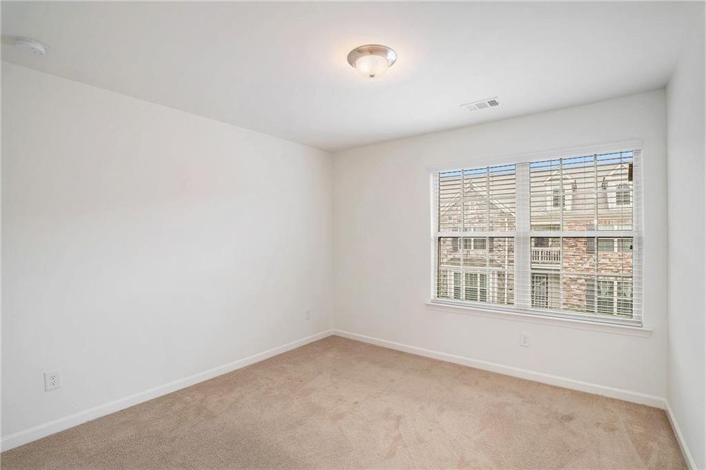 7736 Rutgers Circle Fairburn, GA 30213 - Photo 16 of 39 an empty room with a window