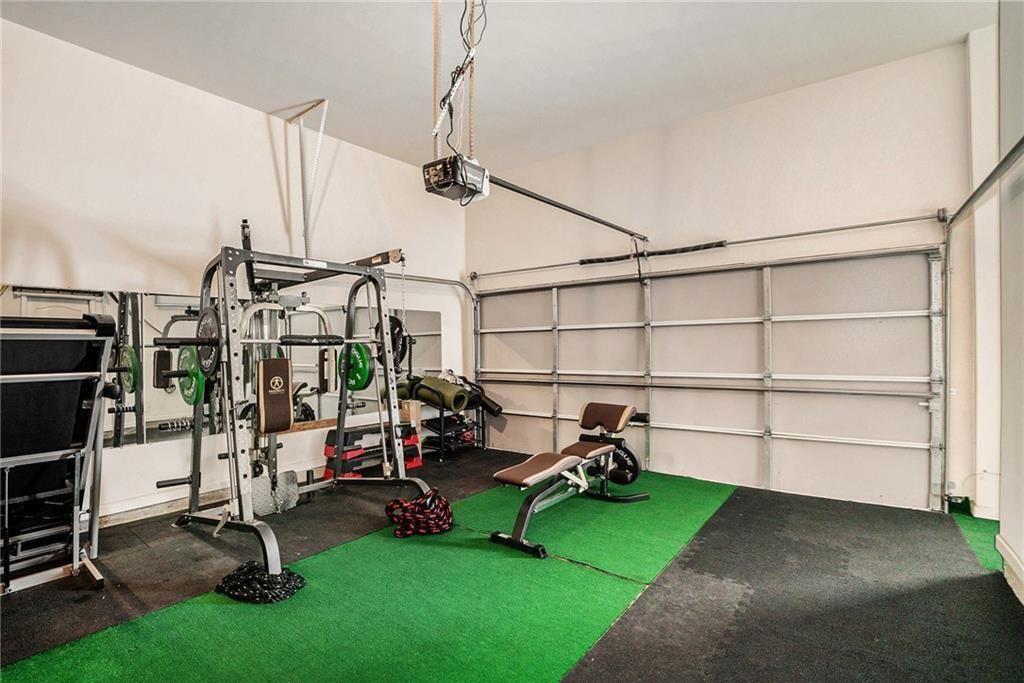 7736 Rutgers Circle Fairburn, GA 30213 - Photo 20 of 39 a view of a room with gym equipment