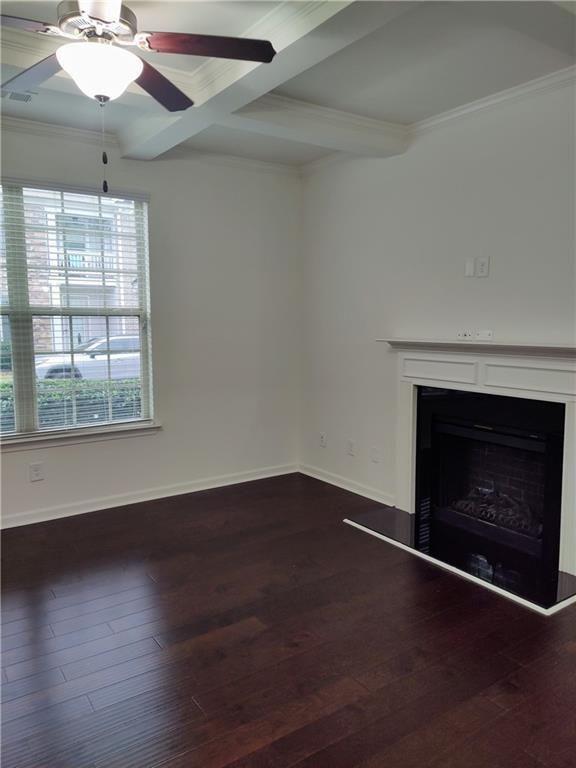 7736 Rutgers Circle Fairburn, GA 30213 - Photo 25 of 39 an empty room with wooden floor a chandelier fan and a fireplace