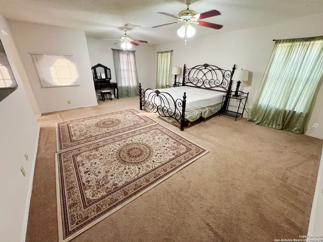 a view of bedroom with furniture and window