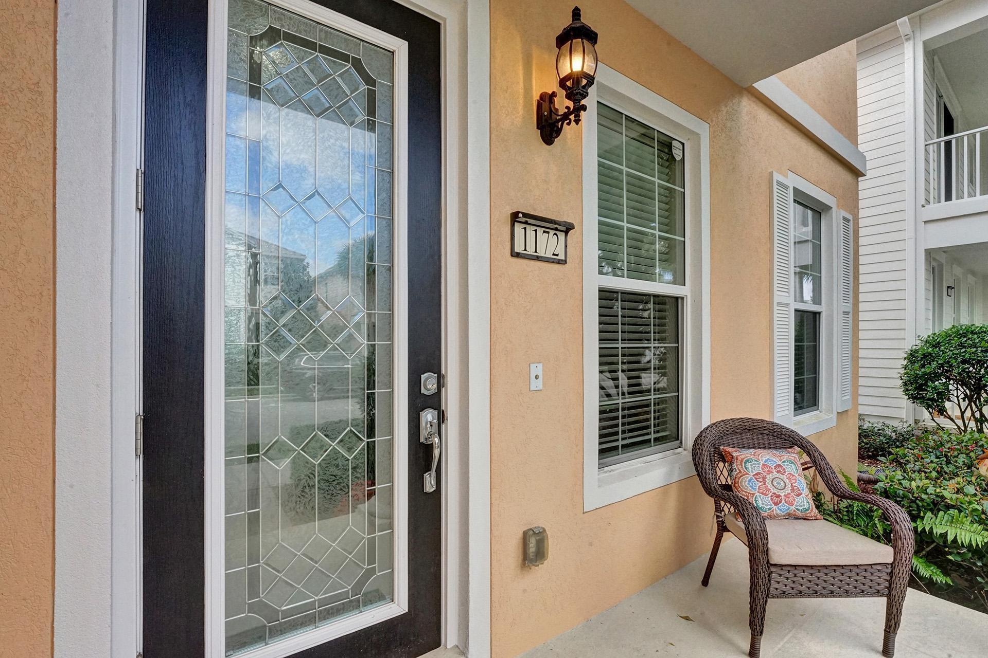 1172 Islamorada Drive Jupiter, FL 33458 - Photo 2 of 42 a view of a door and chair in the balcony