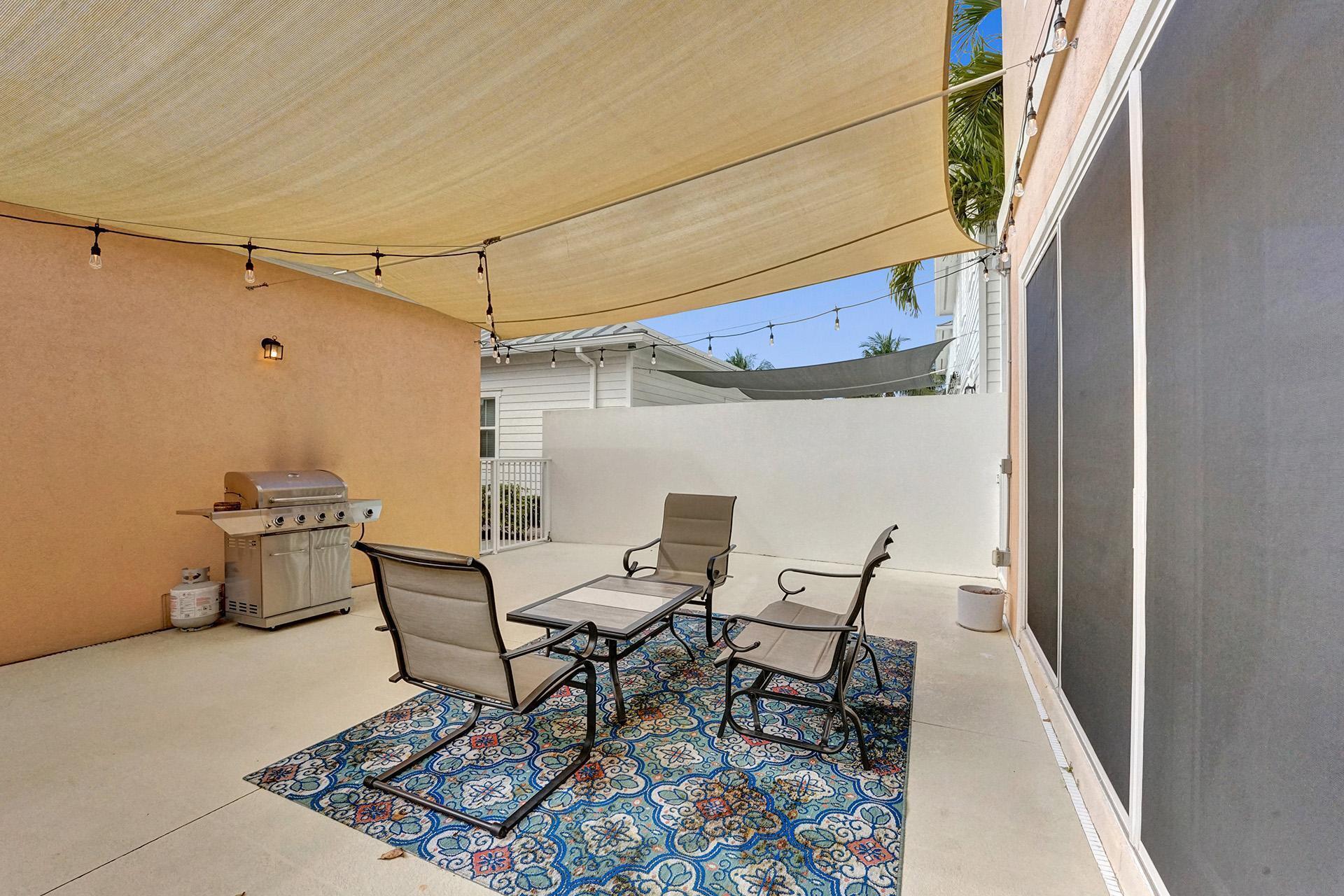 1172 Islamorada Drive Jupiter, FL 33458 - Photo 24 of 42 a view of a chairs and table in the balcony