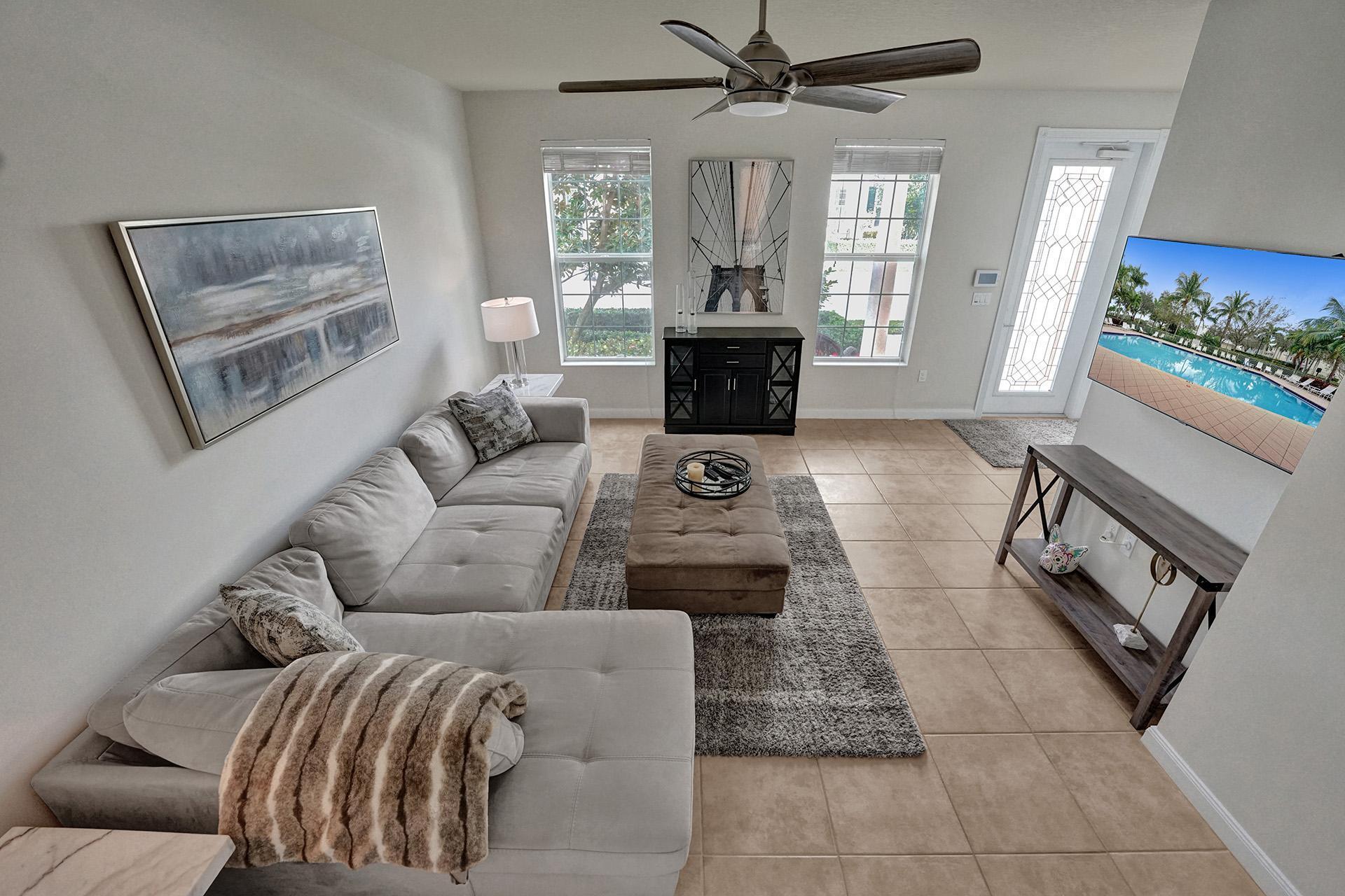 1172 Islamorada Drive Jupiter, FL 33458 - Photo 3 of 42 a living room with furniture and a fireplace