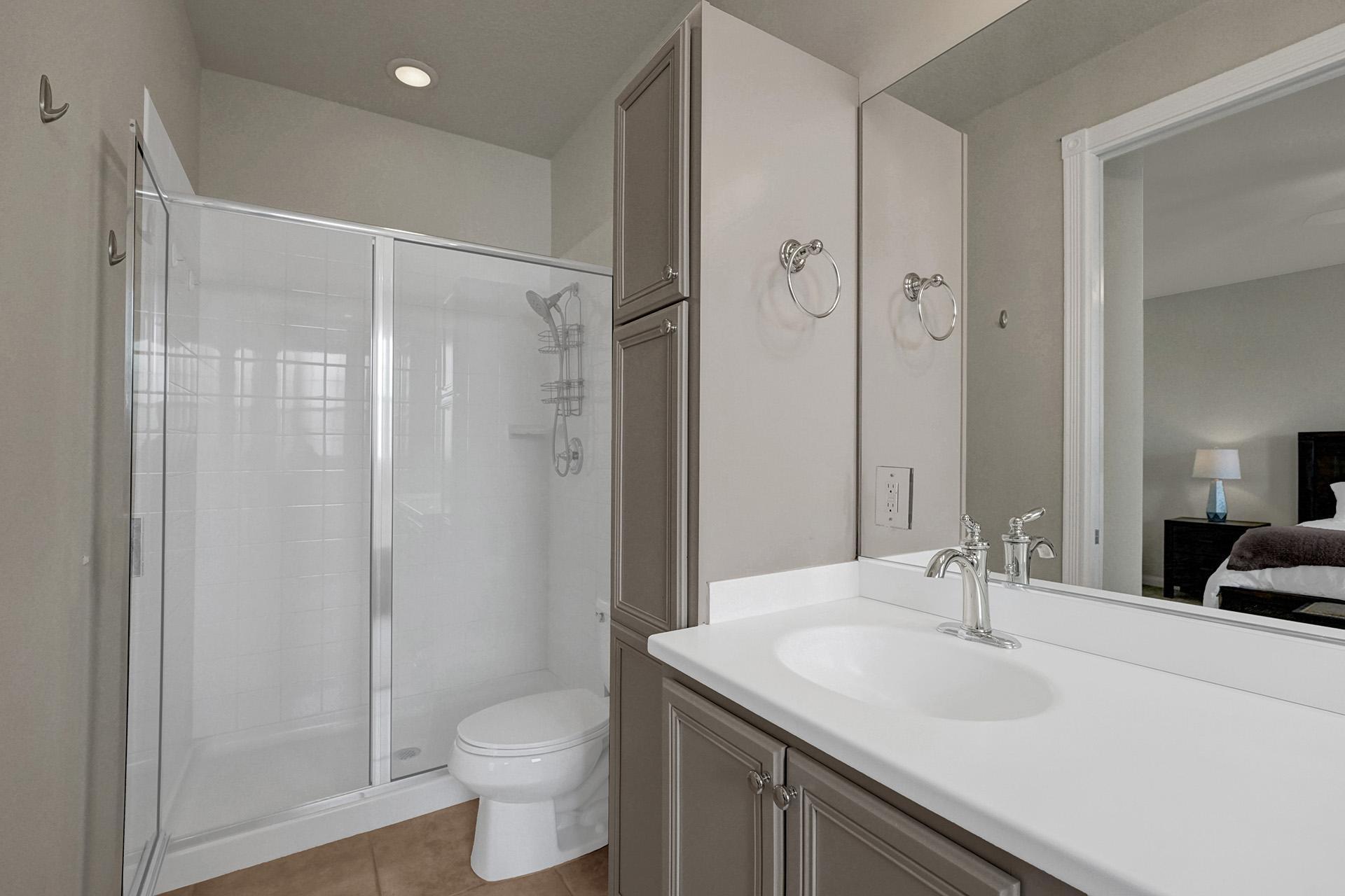 1172 Islamorada Drive Jupiter, FL 33458 - Photo 32 of 42 a bathroom with a sink toilet and shower