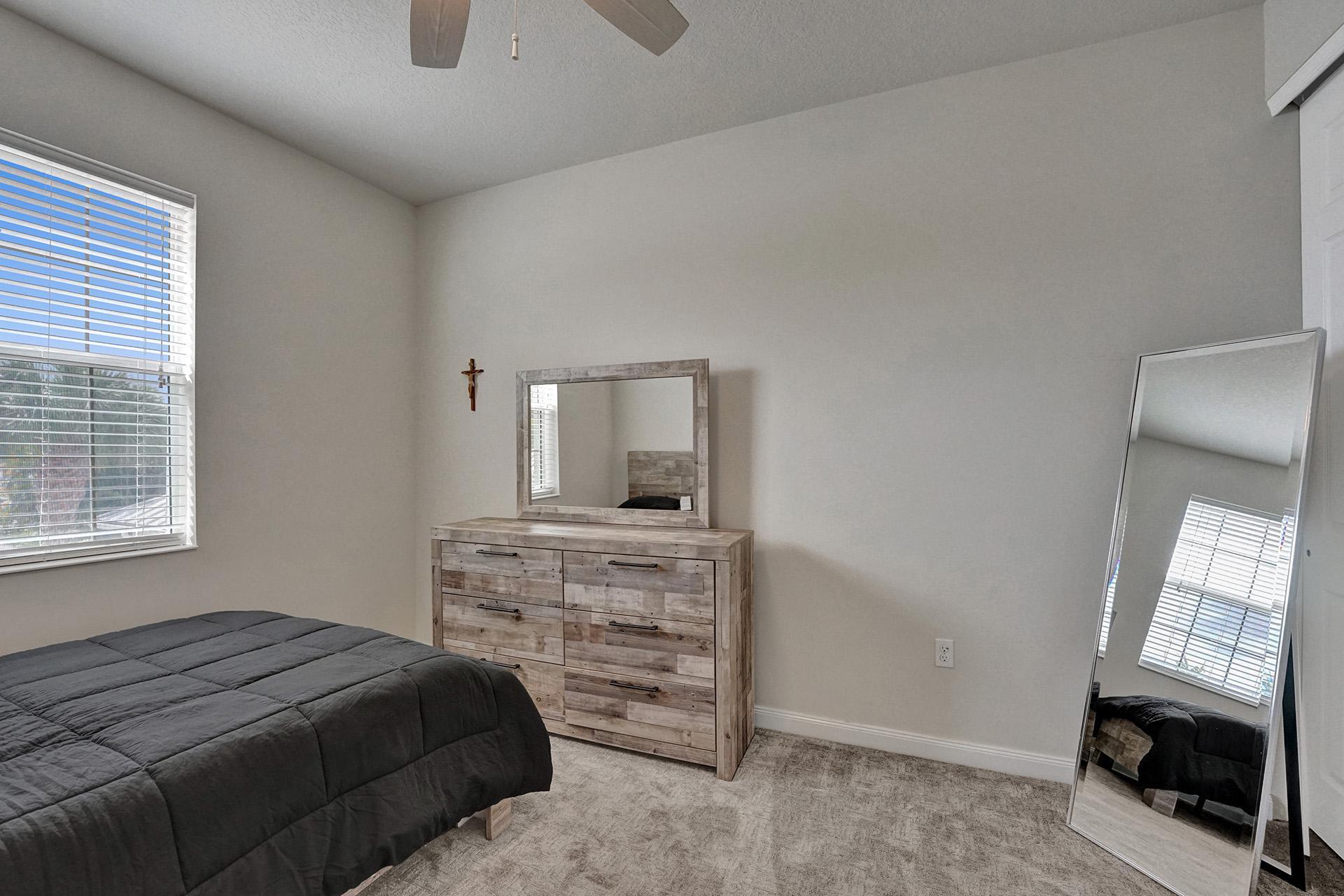 1172 Islamorada Drive Jupiter, FL 33458 - Photo 34 of 42 a bedroom with a bed and a television