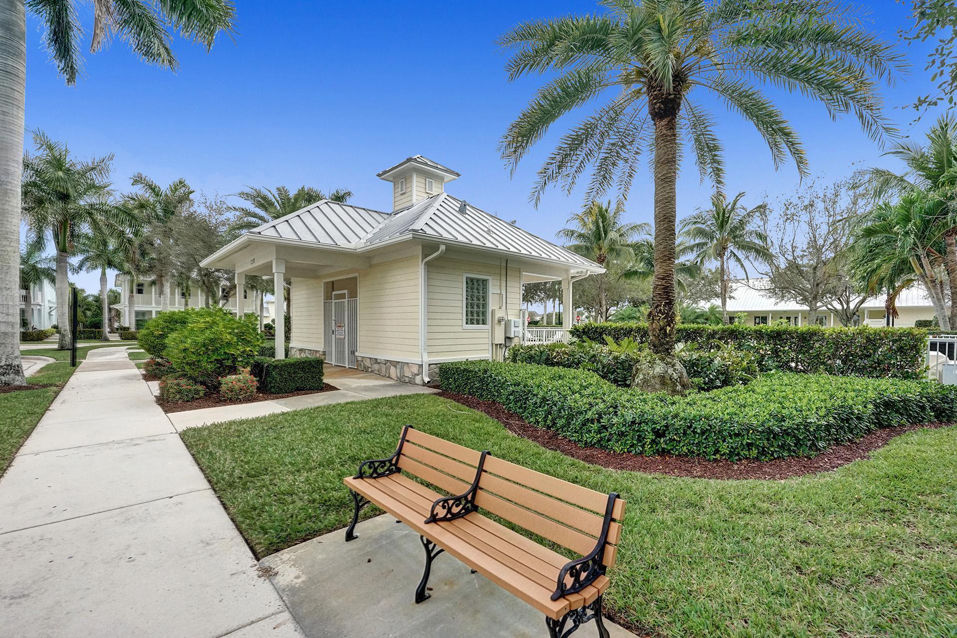 1172 Islamorada Drive Jupiter, FL 33458 - Photo 38 of 42 a view of a house with a yard and sitting area
