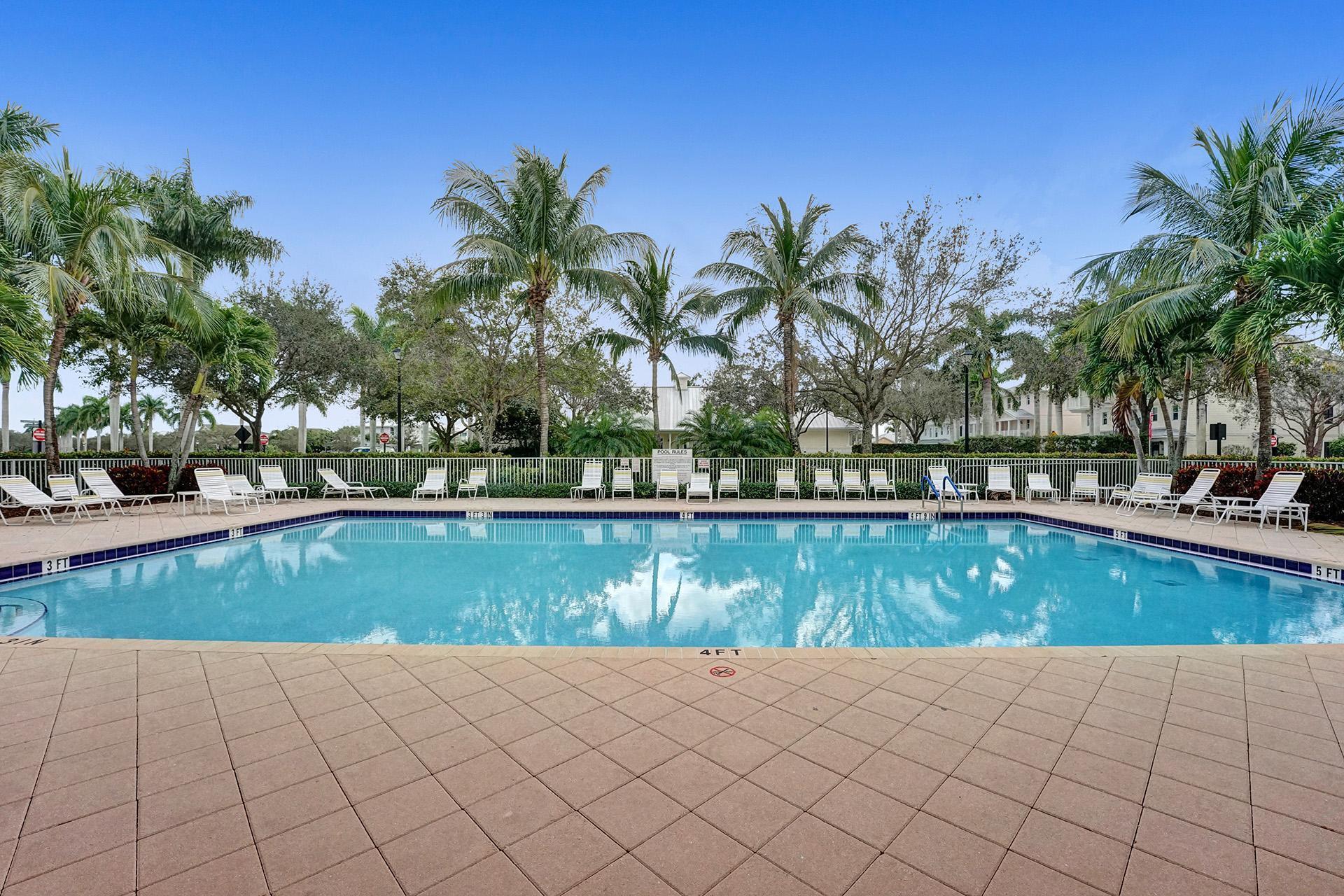 1172 Islamorada Drive Jupiter, FL 33458 - Photo 39 of 42 a view of a swimming pool and a yard