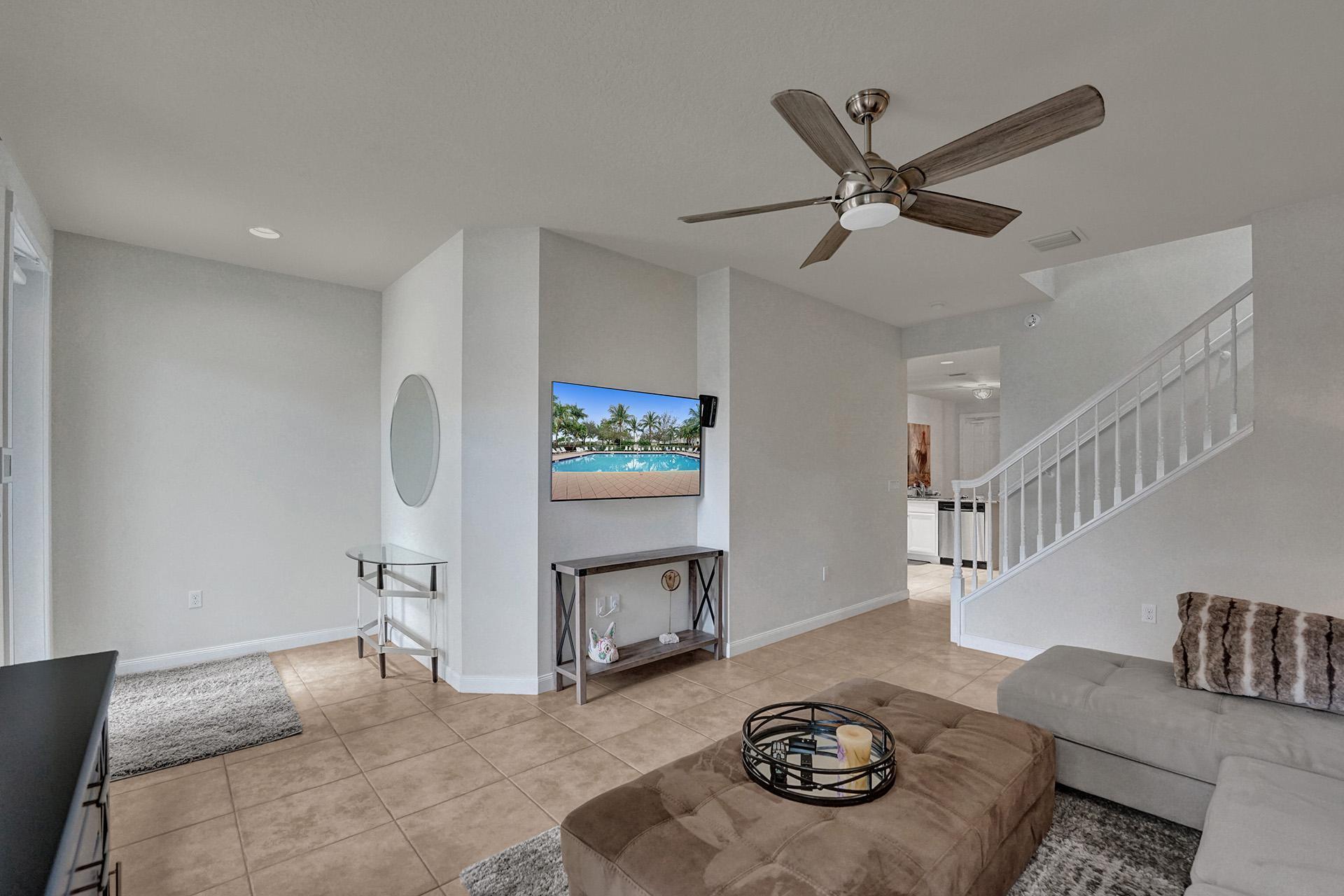 1172 Islamorada Drive Jupiter, FL 33458 - Photo 7 of 42 a living room with furniture and a wooden floor