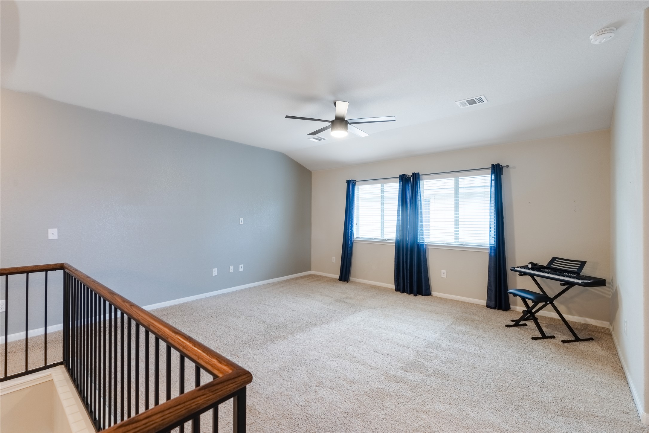 116 Cypress Bend Court Georgetown, TX 78626 - Photo 15 of 35 a view of a livingroom with a ceiling fan and window