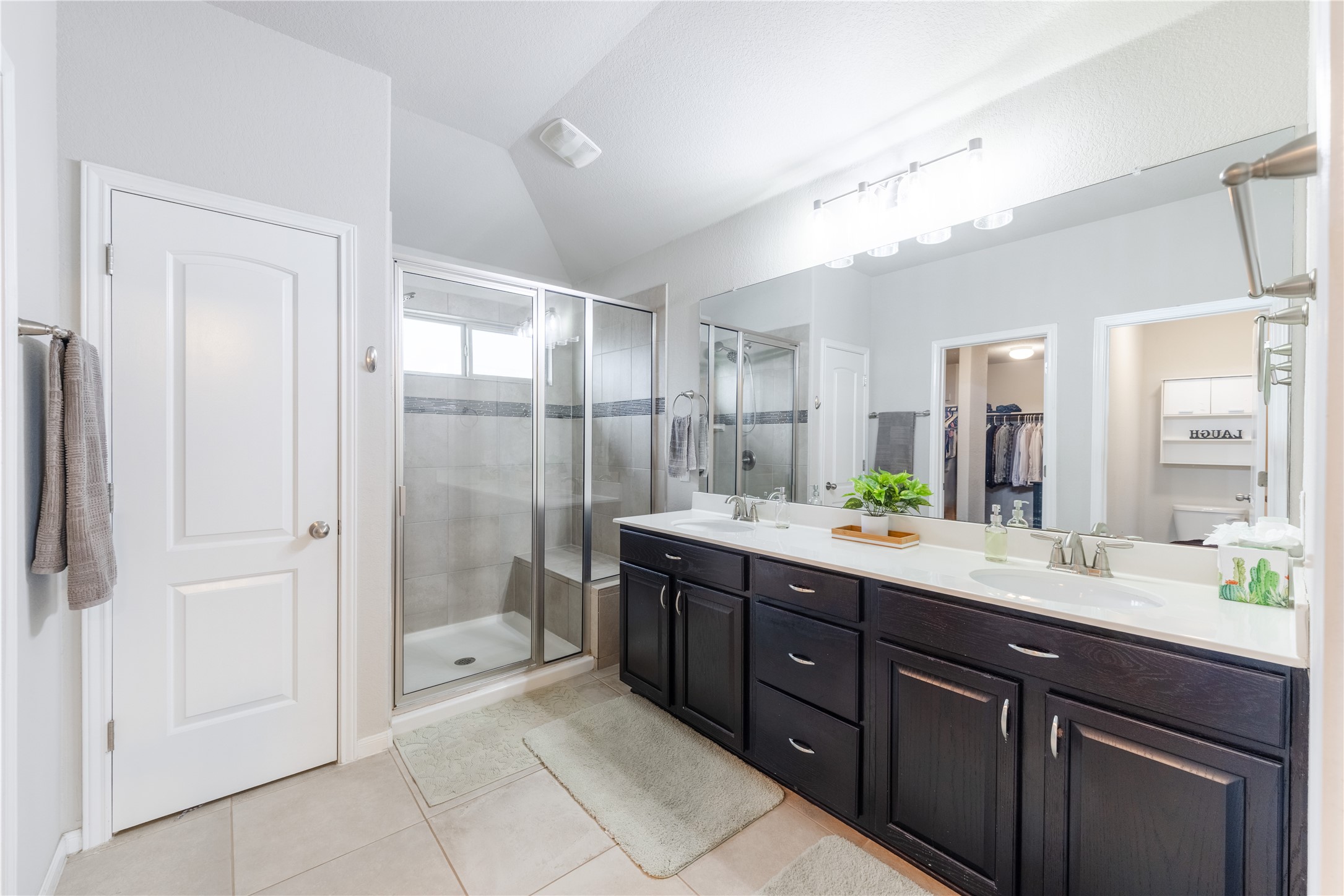 116 Cypress Bend Court Georgetown, TX 78626 - Photo 18 of 35 a spacious bathroom with a shower sink double and mirror