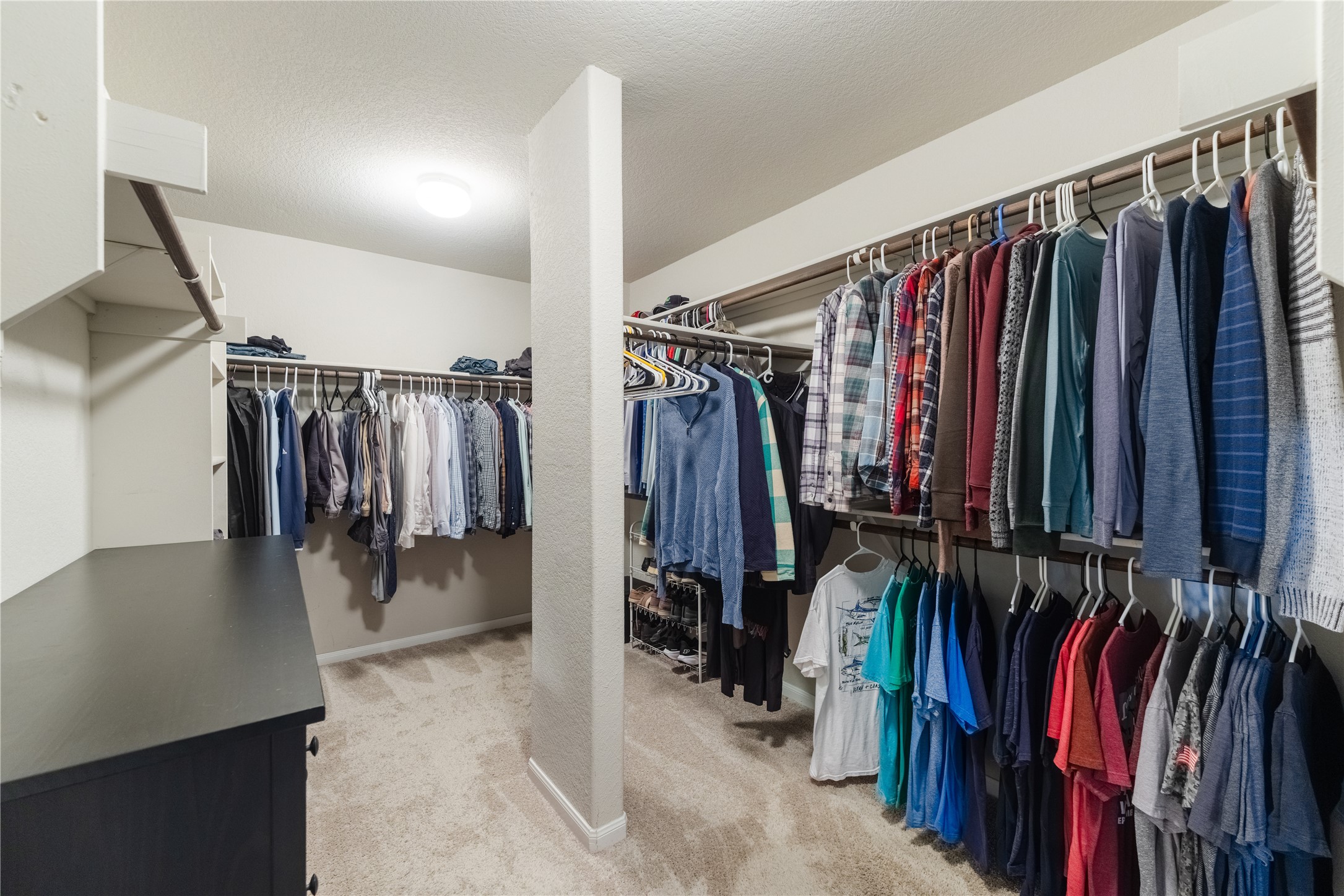 116 Cypress Bend Court Georgetown, TX 78626 - Photo 20 of 35 a view of walk in closet with clothes