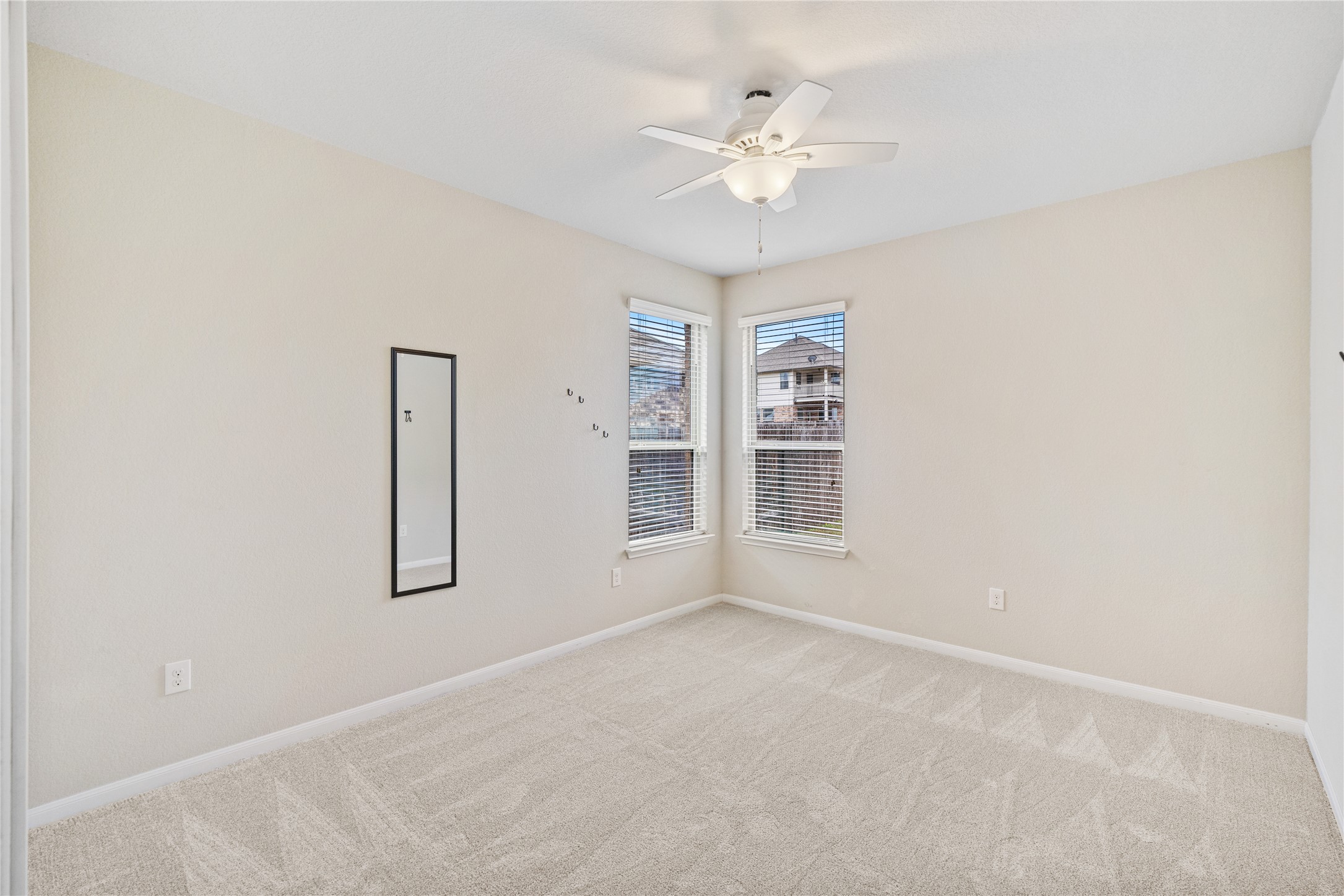 116 Cypress Bend Court Georgetown, TX 78626 - Photo 10 of 35 an empty room with windows and fan