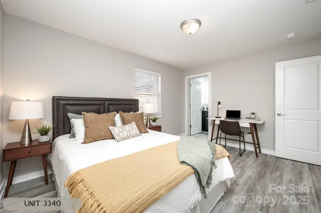 a bedroom with a bed and a couch