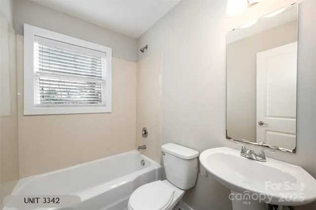 a bathroom with a sink toilet and bathtub