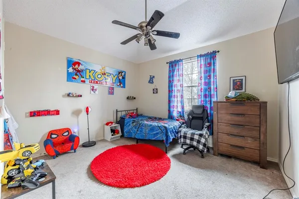 a room with furniture a chandelier and a wooden floor