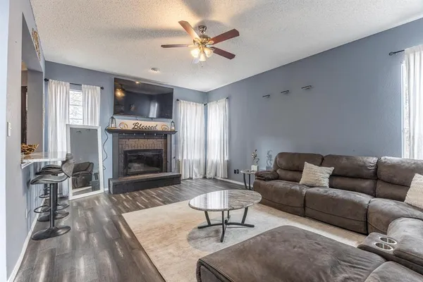 a living room with furniture and a rug