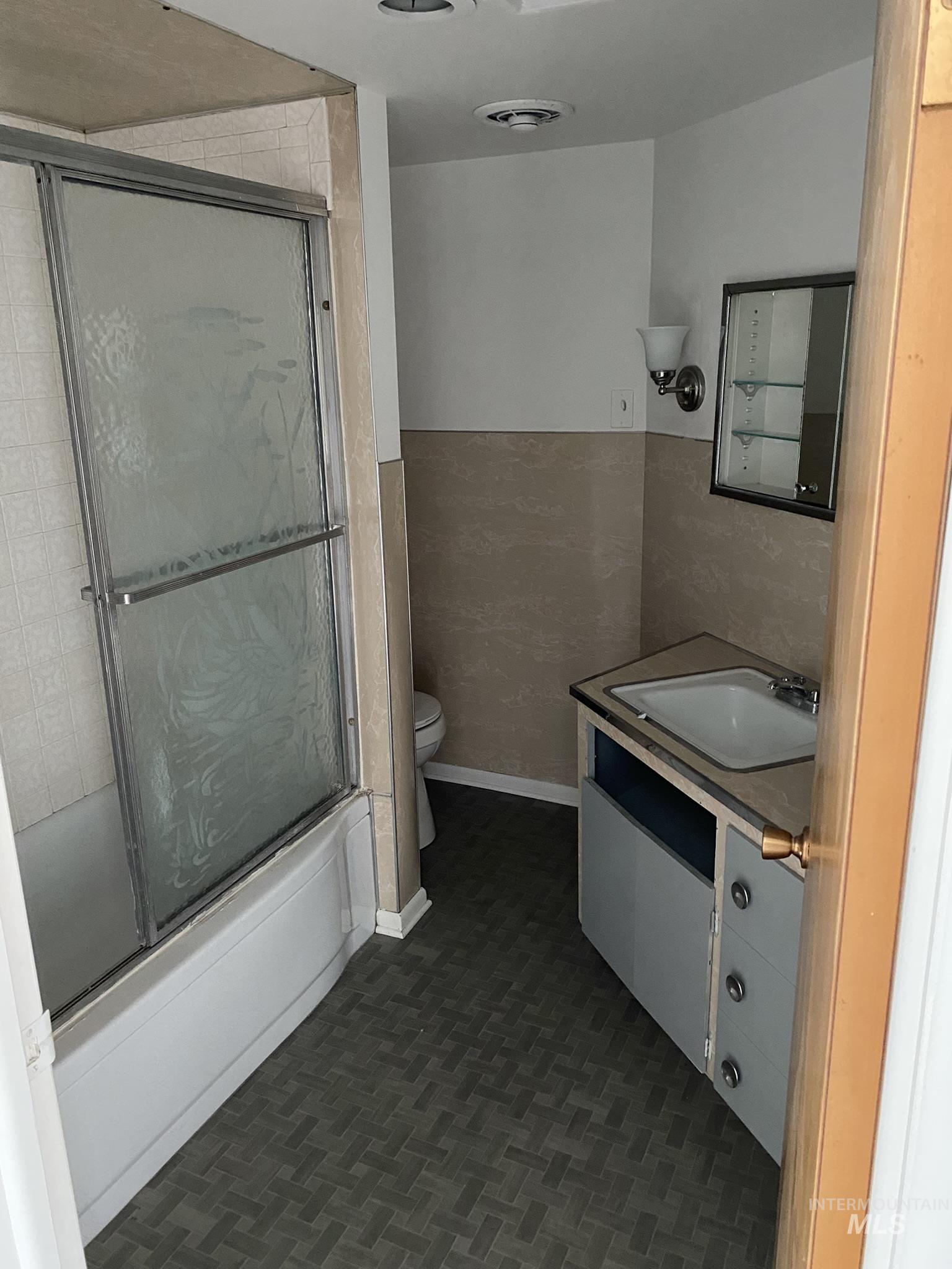 1967 North Fry Street Boise, ID 83704 - Photo 13 of 15 Full bathroom with vanity and combined bath / shower with glass door