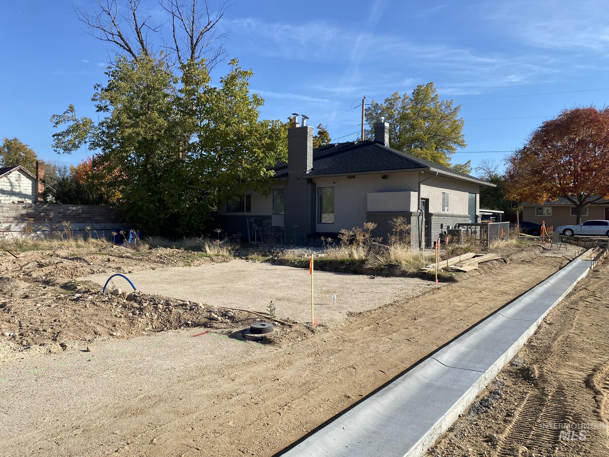 1967 North Fry Street Boise, ID 83704 - Photo 2 of 15 Rear view of house with a chimney and stucco siding