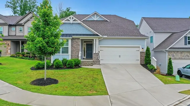 a front view of a house with a yard
