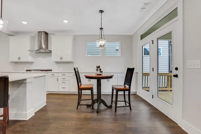 a kitchen with kitchen island appliances cabinets and furniture