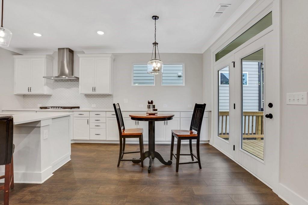 413 Solace Place Canton, GA 30114 - Photo 14 of 75 a view of a dining room with furniture window and wooden floor