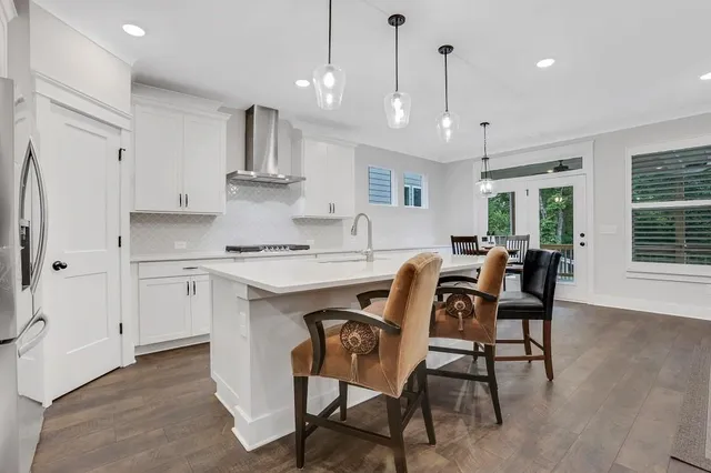 a bedroom with a bed and a ceiling fan