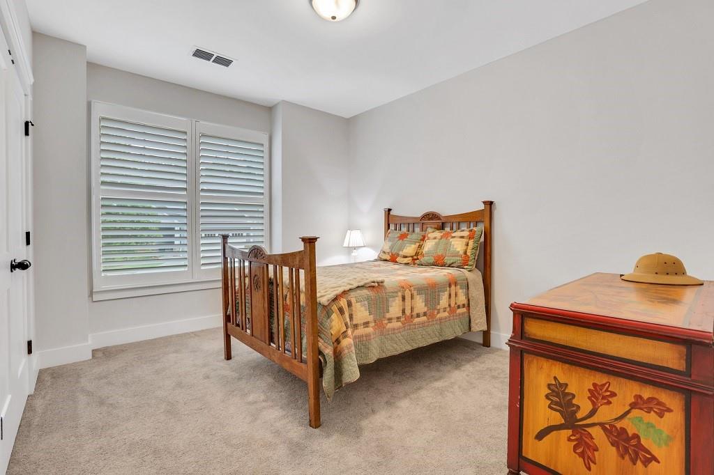 413 Solace Place Canton, GA 30114 - Photo 31 of 75 a bedroom with a bed and a window