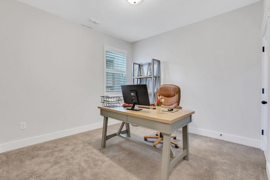 413 Solace Place Canton, GA 30114 - Photo 32 of 75 a workspace with furniture and a window